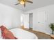 Bright main bedroom with natural light, hardwood floors, and a view of the en suite bathroom at 822 Poplar St, Denver, CO 80220