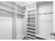 Walk-in closet with multiple shelves and clothing rods at 822 Poplar St, Denver, CO 80220