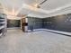 Spacious garage with epoxy floor and slat wall, providing ample storage and a clean look at 1290 W Quincy Cir, Englewood, CO 80110