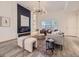 Bright living area featuring modern fireplace, contemporary lighting, and chic furnishings at 1290 W Quincy Cir, Englewood, CO 80110