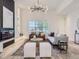 Stylish living room featuring a modern fireplace, contemporary lighting, and chic furnishings at 1290 W Quincy Cir, Englewood, CO 80110