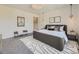 Bright main bedroom featuring a plush rug, neutral decor, and modern lighting at 1290 W Quincy Cir, Englewood, CO 80110