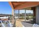 Spacious balcony with city views, seating, and sliding glass door at 100 Park W Ave # 301, Denver, CO 80205