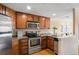 Well-equipped kitchen with granite countertops and stainless steel appliances at 100 Park W Ave # 301, Denver, CO 80205
