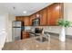 Kitchen with stainless steel appliances, granite countertops and wooden cabinets at 100 Park W Ave # 301, Denver, CO 80205