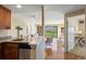 Open floor plan view of the living room with balcony and city views from the kitchen at 100 Park W Ave # 301, Denver, CO 80205