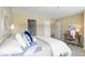 Comfortable bedroom with attached closet and work area, decorated with neutral colors at 100 Park W Ave # 301, Denver, CO 80205