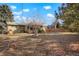 Spacious backyard with mature trees, offering shade and privacy at 3311 S Dahlia St, Denver, CO 80222