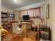 Cozy bedroom with built-in bookshelves, natural light, and hardwood floors at 3311 S Dahlia St, Denver, CO 80222