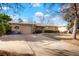 Charming single-story brick home with a well-maintained lawn and attached garage at 3311 S Dahlia St, Denver, CO 80222