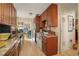 Kitchen features granite countertops, tile floors, and an adjoining dining space at 3311 S Dahlia St, Denver, CO 80222