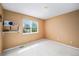 Bright bedroom featuring fresh paint and abundant natural light provides a serene and inviting atmosphere at 5774 S Genoa Ct, Aurora, CO 80015