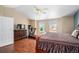 Generously sized main bedroom with plenty of natural light and an ensuite bathroom at 5774 S Genoa Ct, Aurora, CO 80015