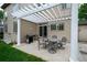 Outdoor patio with pergola cover, providing shade for dining and relaxing with a gas grill at 5774 S Genoa Ct, Aurora, CO 80015