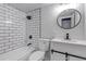 Well-lit bathroom featuring a modern vanity, subway tile, and contemporary fixtures at 3047 W 47Th Ave # 105, Denver, CO 80211