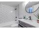Modern bathroom with subway tile shower, sleek fixtures, and contemporary design at 3047 W 47Th Ave # 105, Denver, CO 80211