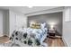 Cozy bedroom featuring a comfortable bed, soft lighting, and stylish décor at 3047 W 47Th Ave # 105, Denver, CO 80211