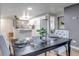 Open concept kitchen and dining room with updated cabinets and stainless appliances at 3047 W 47Th Ave # 105, Denver, CO 80211