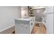 Open concept kitchen design with granite countertop island and stainless steel appliances at 3047 W 47Th Ave # 105, Denver, CO 80211
