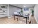 Comfortable living room and dining space with updated flooring and modern decor at 3047 W 47Th Ave # 105, Denver, CO 80211