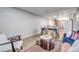 Bright living space seamlessly connecting a dining area and lounge for modern living at 3047 W 47Th Ave # 105, Denver, CO 80211