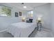 Charming bedroom with a comfortable bed, soft lighting, and tasteful decorations, creating a relaxing atmosphere at 6611 Lamar St, Arvada, CO 80003
