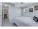 Well-lit bedroom with a cozy bed, closet, and serene ambiance, ideal for a peaceful night's sleep at 6611 Lamar St, Arvada, CO 80003