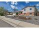Charming home featuring a well-manicured front yard, gravel landscaping, and a two-car garage at 6611 Lamar St, Arvada, CO 80003