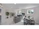 Spacious living room featuring a cozy seating area, fireplace, recessed lighting, and carpet at 6611 Lamar St, Arvada, CO 80003
