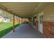 Covered patio with a view of the backyard and shed, perfect for outdoor relaxation and entertaining at 6611 Lamar St, Arvada, CO 80003