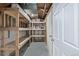 Functional storage room with wooden shelving, perfect for organizing and storing household items efficiently at 6611 Lamar St, Arvada, CO 80003