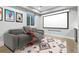 Cozy home theater featuring reclining chairs, projector screen and fun decor at 2150 Eliot St, Denver, CO 80211