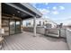 View of spacious outdoor deck with sliding glass door to indoor living area and skyline views at 2150 Eliot St, Denver, CO 80211