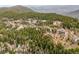 Aerial view of houses nestled among the trees in the community, offering a sense of seclusion and natural beauty at 1673 Sinton Rd, Evergreen, CO 80439