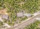 Aerial view of house in a forest, highlighting the property's private location surrounded by trees and nature at 1673 Sinton Rd, Evergreen, CO 80439