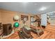 Basement gym area with wood look floors, gym equipment and neutral wall colors at 1673 Sinton Rd, Evergreen, CO 80439
