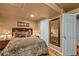 Basement bedroom with carpet, a large bed, and a full length mirror at 1673 Sinton Rd, Evergreen, CO 80439