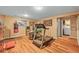 Basement workout area features wood laminate floors, exercise equipment, and motivational signage at 1673 Sinton Rd, Evergreen, CO 80439