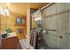 Bathroom featuring wood paneling, granite countertops, and a glass enclosed shower at 1673 Sinton Rd, Evergreen, CO 80439