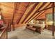 This bedroom includes exposed beams, wood paneled ceilings, and recessed lighting at 1673 Sinton Rd, Evergreen, CO 80439