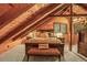 This bedroom includes exposed beams, wood paneled ceilings, and recessed lighting at 1673 Sinton Rd, Evergreen, CO 80439