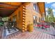 Inviting outdoor space with comfortable seating and log cabin details, perfect for enjoying scenic views and relaxation at 1673 Sinton Rd, Evergreen, CO 80439
