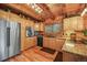 Well-appointed kitchen featuring stainless steel appliances, custom wood cabinets, and granite countertops, offering style and functionality at 1673 Sinton Rd, Evergreen, CO 80439