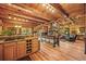 Open-concept living space with wood accents, offering seamless flow between the kitchen, dining, and living areas at 1673 Sinton Rd, Evergreen, CO 80439
