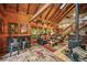 Open-concept living area with a fireplace, comfortable seating, and natural light, perfect for entertaining and relaxation at 1673 Sinton Rd, Evergreen, CO 80439