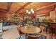 Spacious open-concept living room with a kitchen, dining area, and comfortable seating, ideal for gatherings and relaxation at 1673 Sinton Rd, Evergreen, CO 80439
