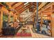 Inviting open-plan living room with vaulted ceilings, wood accents, a fireplace, and comfortable seating for relaxation at 1673 Sinton Rd, Evergreen, CO 80439