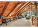Comfortable loft area featuring vaulted ceilings, plush seating, and picturesque views for versatile living space at 1673 Sinton Rd, Evergreen, CO 80439