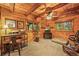 This office features wood paneled walls, recessed lighting, and views to the exterior at 1673 Sinton Rd, Evergreen, CO 80439