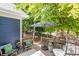 Relaxing back deck with comfortable seating and shade, surrounded by lush trees at 1038 Mircos St, Erie, CO 80516